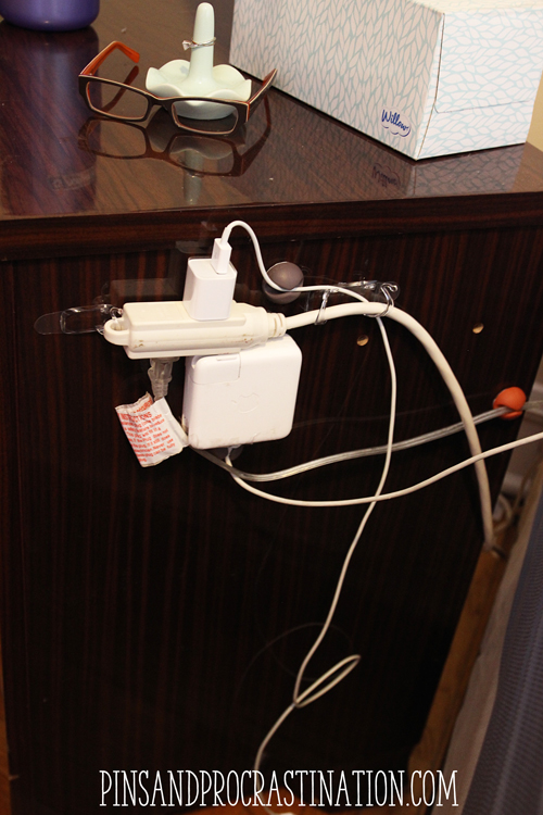 Is your bedside a tangle of jumbled cords? I have 3 different chargers, a lamp, and an extension cord all right there, and they really turn into a mess. That's why I came up with this easy cord organization solution! If you want neat cords, just read this to find an easy tutorial on how to organize your cords.